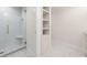 Bright bathroom featuring glass enclosed shower with white subway tiles and gold hardware at 1 Mooregate Sq, Atlanta, GA 30327
