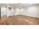 Spacious bedroom featuring wood flooring, closets, and white trim work throughout the home at 1 Mooregate Sq, Atlanta, GA 30327