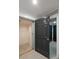 A residential elevator featuring a gray door and neutral walls for convenient access between floors at 1 Mooregate Sq, Atlanta, GA 30327