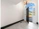 Stylish entryway with tiled floors, decorative chandelier, and a glimpse of the exterior through a glass door at 1 Mooregate Sq, Atlanta, GA 30327