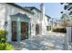 Backyard of an elegant home with a stone patio, architectural details, and lush landscaping, ideal for relaxation at 1 Mooregate Sq, Atlanta, GA 30327