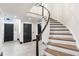 Inviting foyer with a curved staircase, tiled floors, and stylish doors that offer a warm welcome at 1 Mooregate Sq, Atlanta, GA 30327