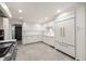 This kitchen is equipped with custom cabinets, marble countertops, and stainless steel appliances, perfect for cooking enthusiasts at 1 Mooregate Sq, Atlanta, GA 30327