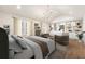 Luxurious main bedroom with natural light and a vaulted ceiling, complete with custom built-in shelving and decor at 1 Mooregate Sq, Atlanta, GA 30327