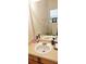 The bathroom features a sink with chrome fixtures, ample counter space, and a large mirror, perfect for everyday routines at 116 Ventura Trl, Stockbridge, GA 30281