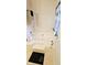 The bathroom showcases a white bathtub with tiling, accented by natural light and decorative curtains and plants at 116 Ventura Trl, Stockbridge, GA 30281