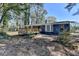 View of the backyard featuring deck and patio at 4756 Fellsridge Dr, Stone Mountain, GA 30083