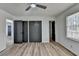 A light and airy bedroom offers wood-look floors, with many doors and a large window at 4756 Fellsridge Dr, Stone Mountain, GA 30083