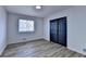 Cozy bedroom featuring a closet, hard surface flooring and natural light at 4756 Fellsridge Dr, Stone Mountain, GA 30083