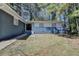 Charming single-story home with a blue brick exterior and a well-maintained front yard at 4756 Fellsridge Dr, Stone Mountain, GA 30083
