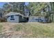 Charming single-story home with blue and white brick exterior surrounded by mature trees at 4756 Fellsridge Dr, Stone Mountain, GA 30083