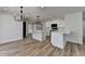 Modern kitchen featuring stainless steel appliances, white cabinets, countertops, and hardwood floors at 4756 Fellsridge Dr, Stone Mountain, GA 30083