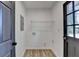 Functional laundry room with wire shelving and convenient access to the exterior at 4756 Fellsridge Dr, Stone Mountain, GA 30083