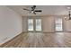 Light-filled living area featuring large windows and hard surface floors at 4756 Fellsridge Dr, Stone Mountain, GA 30083