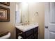 Bathroom featuring a dark wood vanity with marble countertop and modern fixtures at 100 Marietta Walk Trce, Marietta, GA 30064