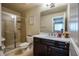Bathroom featuring glass shower and dark wood vanity with marble countertop at 100 Marietta Walk Trce, Marietta, GA 30064