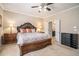 Bedroom featuring an ornate wooden bed, soft carpet, and plenty of natural light at 100 Marietta Walk Trce, Marietta, GA 30064