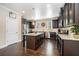Spacious kitchen with dark cabinets, granite counters, and stainless steel appliances at 100 Marietta Walk Trce, Marietta, GA 30064
