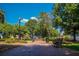 Scenic park with lush greenery, flowering trees, and charming benches for relaxation at 100 Marietta Walk Trce, Marietta, GA 30064