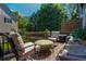 Inviting patio area featuring comfortable seating arrangements for outdoor enjoyment and relaxing at 100 Marietta Walk Trce, Marietta, GA 30064