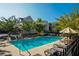 Sparkling community pool surrounded by lounge chairs, perfect for relaxation and summer fun at 100 Marietta Walk Trce, Marietta, GA 30064