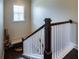 Classic staircase with white railings, dark wood accents, and a decorative bench at 100 Marietta Walk Trce, Marietta, GA 30064