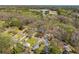 The neighborhood aerial reveals a landscape of trees and rooftops, showcasing the community's layout at 1181 Angelia Sw Dr, Mableton, GA 30126