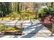 A fenced backyard features a patio area and landscaping, providing a private outdoor space at 1181 Angelia Sw Dr, Mableton, GA 30126