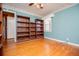 Bedroom features hardwood floors and built in bookshelves at 1181 Angelia Sw Dr, Mableton, GA 30126