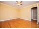 Bedroom with hardwood floors features neutral paint and open door at 1181 Angelia Sw Dr, Mableton, GA 30126