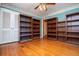 A cozy bedroom features hardwood floors and plenty of shelving at 1181 Angelia Sw Dr, Mableton, GA 30126