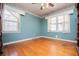 Bedroom features hardwood floors, a window, and wallpaper border at 1181 Angelia Sw Dr, Mableton, GA 30126