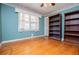 Bedroom features hardwood floors, a window, and built in bookshelves at 1181 Angelia Sw Dr, Mableton, GA 30126