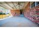 Spacious covered patio featuring ceiling fans and brick walls at 1181 Angelia Sw Dr, Mableton, GA 30126
