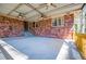 View of the covered patio featuring ceiling fans and brick walls at 1181 Angelia Sw Dr, Mableton, GA 30126
