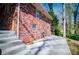 Brick home featuring a spacious patio area, perfect for outdoor entertaining and relaxation at 1181 Angelia Sw Dr, Mableton, GA 30126