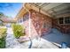 Charming brick home featuring a covered carport and a cozy patio with a decorative fountain at 1181 Angelia Sw Dr, Mableton, GA 30126