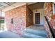 Front entrance with a decorative lion fountain and a secure storm door at 1181 Angelia Sw Dr, Mableton, GA 30126