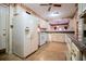 Charming kitchen with white appliances, spacious countertops and classic design elements at 1181 Angelia Sw Dr, Mableton, GA 30126