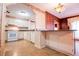 Traditional kitchen featuring white appliances, countertops, and decorative wallpaper at 1181 Angelia Sw Dr, Mableton, GA 30126