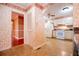 Traditional kitchen with white appliances, decorative wallpaper, and tile flooring at 1181 Angelia Sw Dr, Mableton, GA 30126