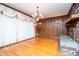 Charming living room with hardwood floors, brick fireplace, and elegant window treatments at 1181 Angelia Sw Dr, Mableton, GA 30126