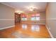 Hardwood floors, brick accent wall, and bright windows highlight this well-lit living room at 1181 Angelia Sw Dr, Mableton, GA 30126