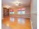 Sun-filled living area with hardwood floors, brick wall, and traditional design elements at 1181 Angelia Sw Dr, Mableton, GA 30126