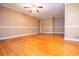 Spacious living room with hardwood floors, neutral walls, and classic ceiling fan at 1181 Angelia Sw Dr, Mableton, GA 30126