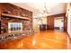 Open-concept living room with hardwood floors, fireplace, and seamless flow at 1181 Angelia Sw Dr, Mableton, GA 30126
