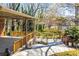 Enjoy the outdoors on this patio with concrete flooring, wood railings, and views of the landscaped backyard at 1181 Angelia Sw Dr, Mableton, GA 30126