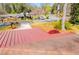 View of a roof with a red steel awning over a porch and a shingled roof in the foreground at 1181 Angelia Sw Dr, Mableton, GA 30126