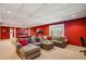 Finished basement with large sectional sofa, billiard table, and a treadmill offers space for relaxation and recreation at 1562 Asheforde Dr, Marietta, GA 30068