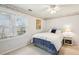Cozy bedroom with a double window for natural light and beach-themed wallpaper at 1562 Asheforde Dr, Marietta, GA 30068